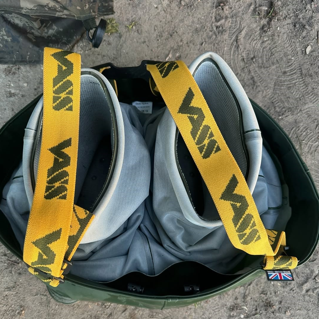 Yellow-strapped green boots with UK flag emblem