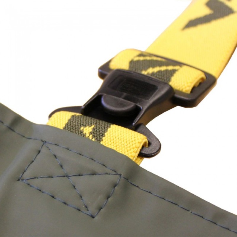 Yellow strap with black buckle on green fabric.